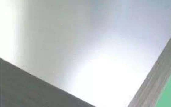 Production method of tinned steel plate